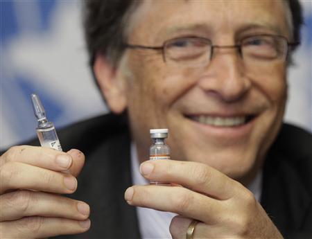 Gates co-chair of the Bill & Melinda Gates Foundation poses with vaccine against meningitis during a news conference at the United Nations in Geneva