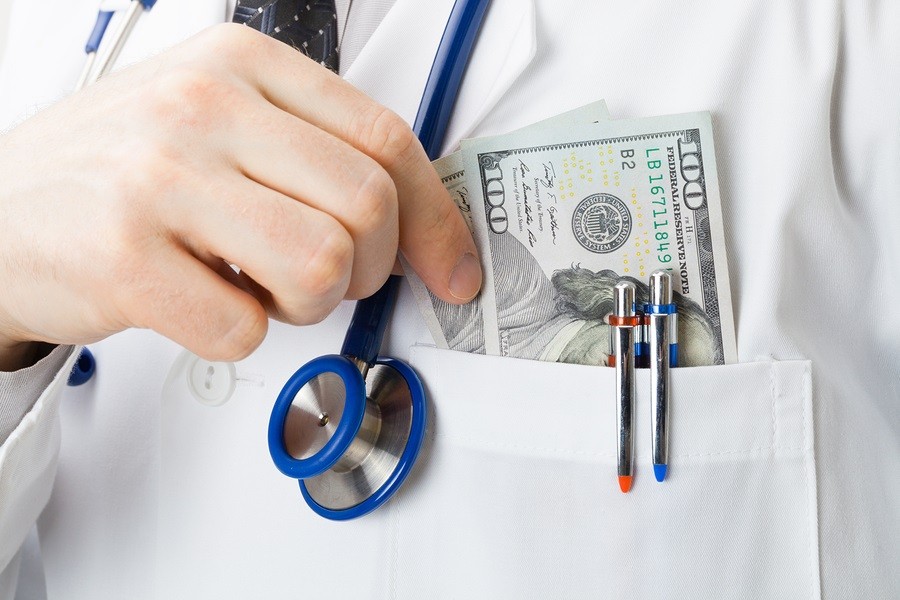 Medical doctor with US dollars in his pocket