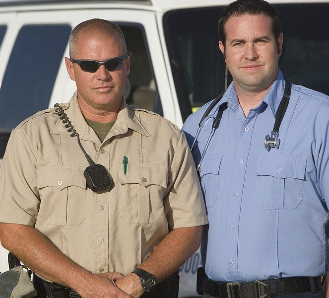 traffic cop and EMT doctor standing together