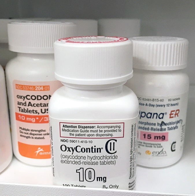 ogden Utah: July 16, 2016- oxycontin bottle with opana and percocet bottle on pharmacy shelf