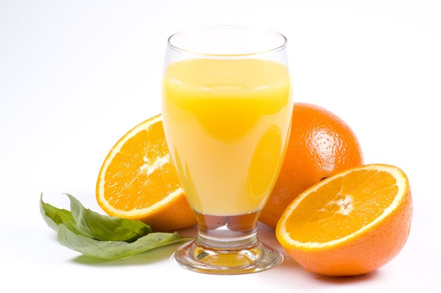 a picture of some juicy oranges and a glass of orange juice