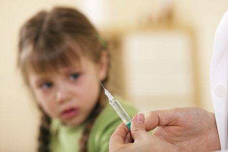 Stock photo of child receiving vaccination