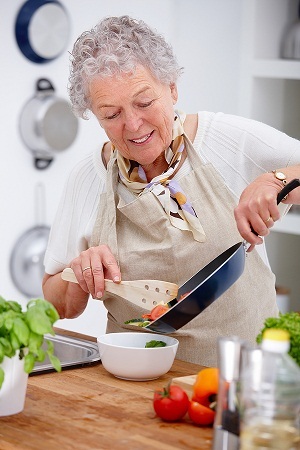 Seniors cooking with coconut oil photo