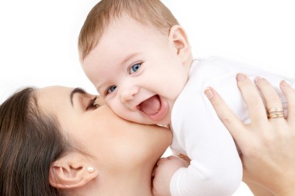 laughing baby playing with mother