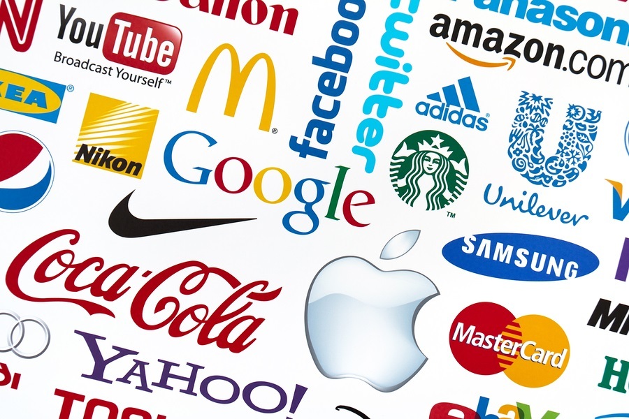 A logotype collection of well-known world brand's printed on paper. Include Google, McDonald's, Nike, Coca-Cola, Facebook, Apple and others logo.