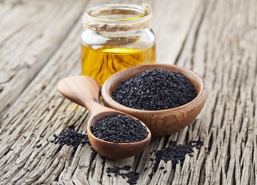Black cumin oil with seeds picture