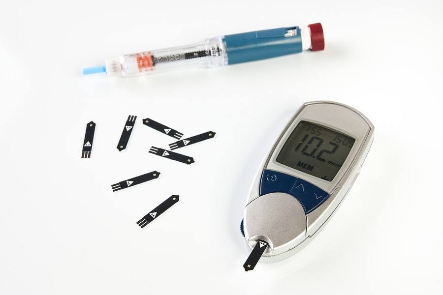 Diabetes equipment Insulin pen and glucose level blood test isolated on white background image