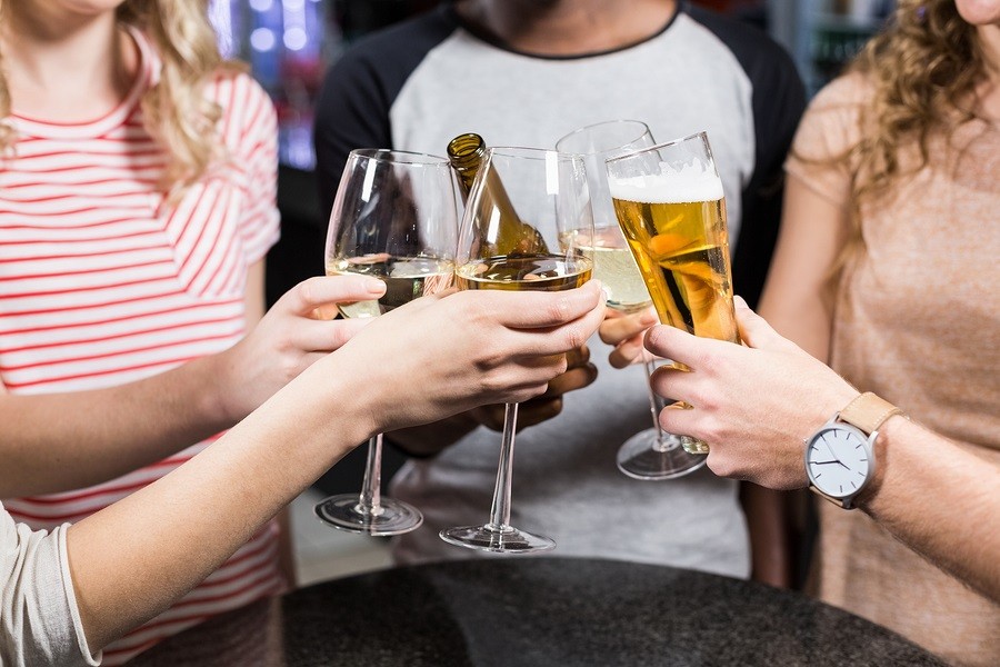 Group of friends toasting with beer and wine photo