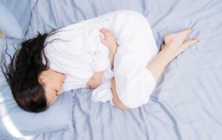 Pregnant woman with abdominal pain. Pain during menstruation. Abortion and infertility. Abdominal pain in women.