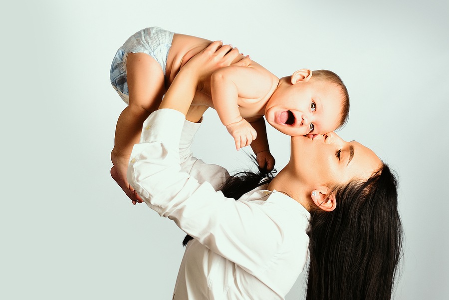 Happy Family. Mother Holding Small Child. Family Concept. Woman