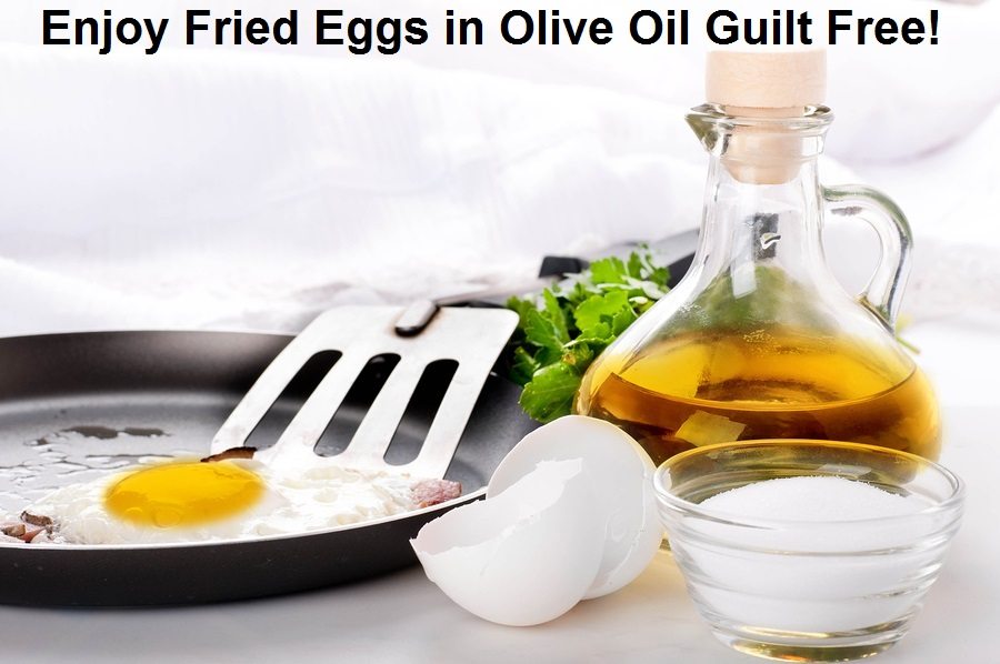 Fried eggs on a frying pan with olive oil